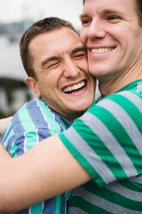 "Happy Gay Couple Hugging Outdoors" by Stocksy Contributor "Simone Wave ...