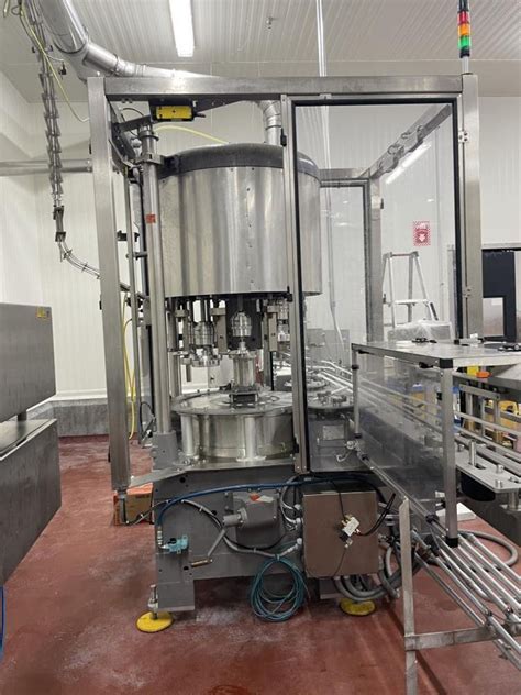 Pneumatic Scale Model TC-600-8 Rotary Capper. Machine is capable of ...