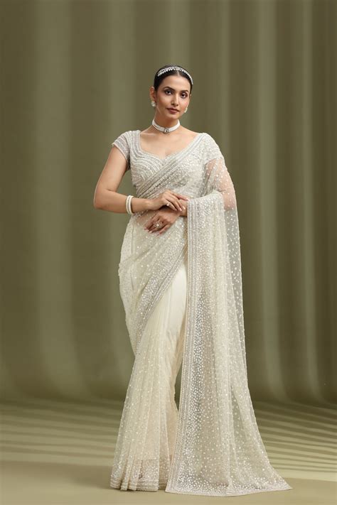 Buy Ivory Net Saree with Sequins & Cutdana Work (Unstitched)