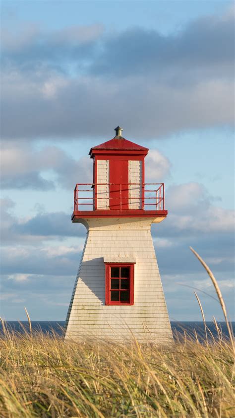 Download wallpaper 1080x1920 lighthouse, grass, clouds, sea samsung ...