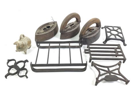 Lot - (9pc) Cast Iron Sad Irons, Sad Iron Trivets