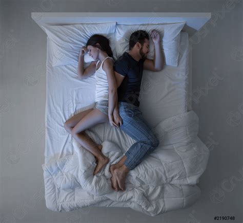Couple sleeping in bed - stock photo | Crushpixel