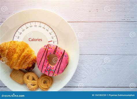 Calories Counting and Food Control Concept. Doughnut ,croissant and ...