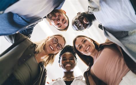Happy diverse friends standing and smiling at camera | Duke City Recovery