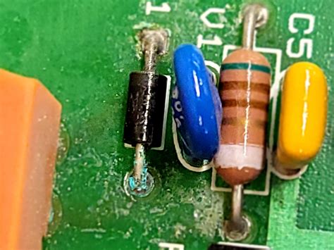 What is this called? And how do I replace it? (Black doodad) : r/microchip