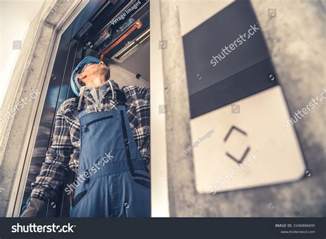 Professional Caucasian Elevator Technician Fixing Lift Stock Photo 2246886695 | Shutterstock