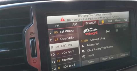 What does battery discharge warning mean on Kia Sportage?