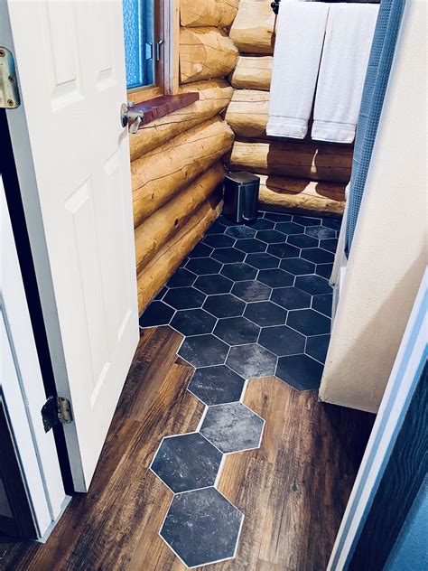 Modern hexagon tile flooring to wood transition | Basement bathroom ...