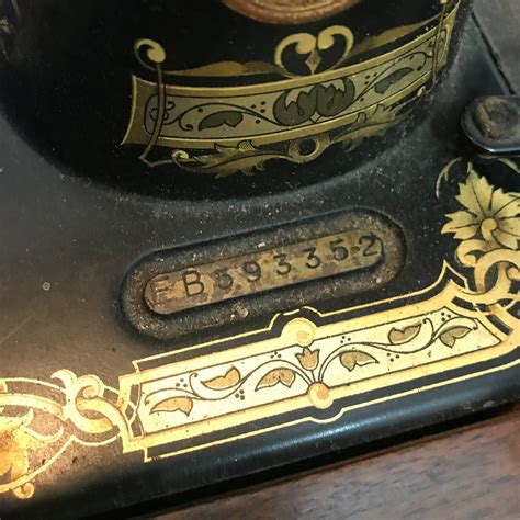 A Vintage Singer sewing machine serial number EB593352. Comes with ...