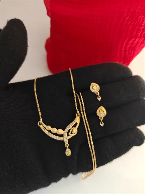 Buy Elegant Gold Finish Designer Pendant Set With Matching Earrings For ...