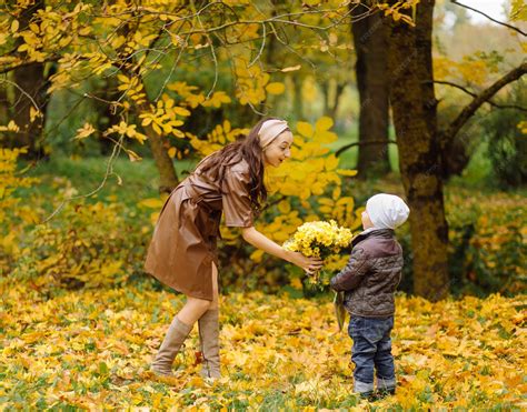 Mom and son walking and having fun together in the autumn park. | Free ...