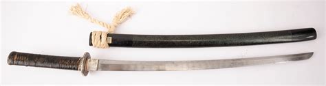 At Auction: A Japanese short sword or Wakizashi. The Edo period blade ...