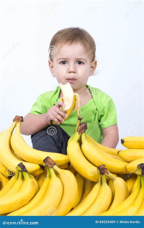 Cute baby eating banana stock image. Image of ripe, health - 84529409