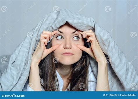 Close-up Frontal Portrait of a Woman Holding Her Eyes with Her Hands, Suffering from Insomnia ...