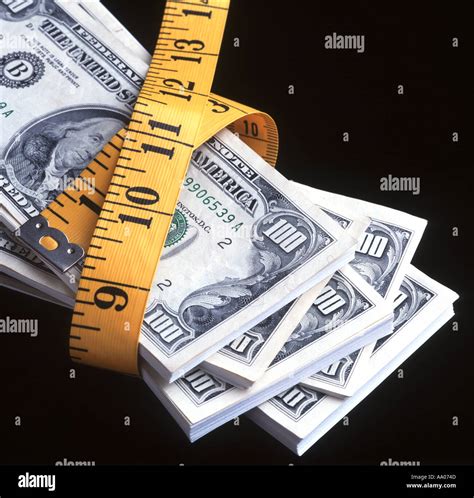 bundles of 100 dollar bills US wrapped with tape measure Stock Photo - Alamy - measurement of dollar bill
