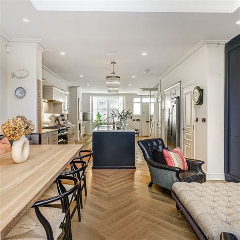 A loft conversion in Wandsworth, London features herringbone wood flooring
