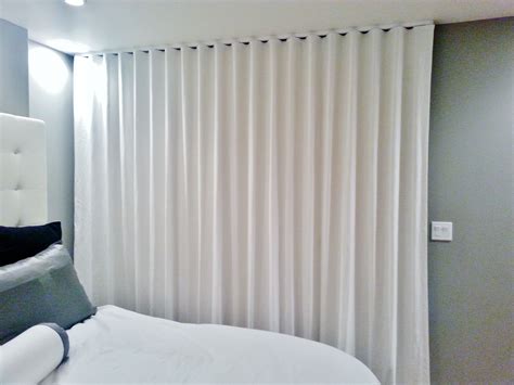 Ripplefold drapery panels on ceiling mounted architrac rod | Dazzling ...