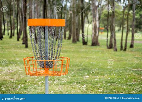 Disc golf basket in a park stock image. Image of frolf - 272327265