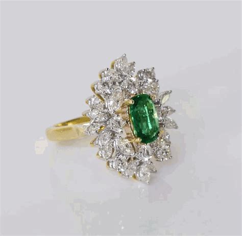 Stunning ring with vivid oval emerald of exceptional color and quality ...