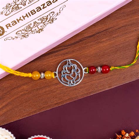 Send Pure Silver Ganesha Rakhi for Brother Online - RKH23-110945 ...