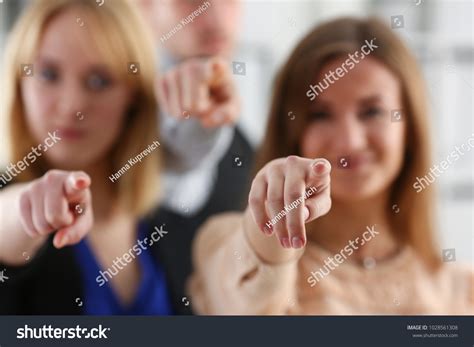 Group of People Standing in Office Pointing 的图像结果