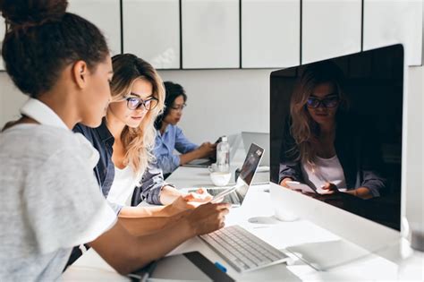 Black female it-specialist sitting beside modern computer with black ...