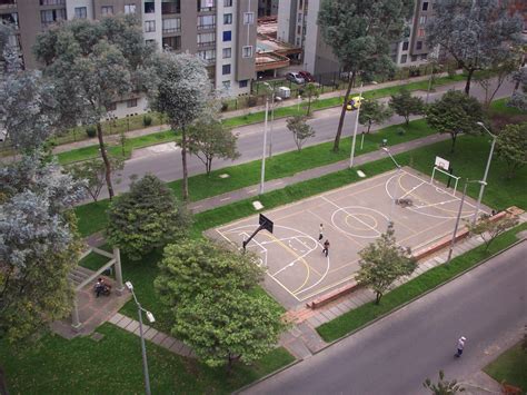Basketball court built into a road median in Bogota | Home basketball ...
