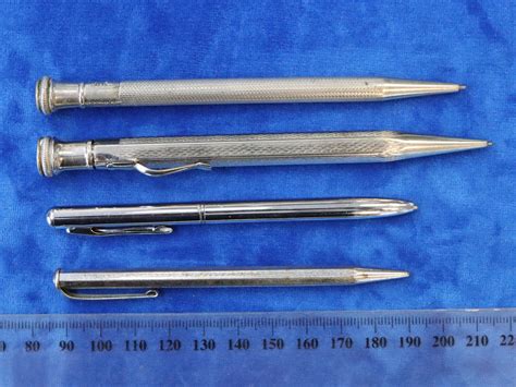 Lot - 4 PROPELLING PENCILS