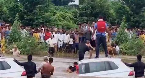 Couple Sit On Volkswagen Tiguan's Roof To Escape Flood: Rescued After 2 ...
