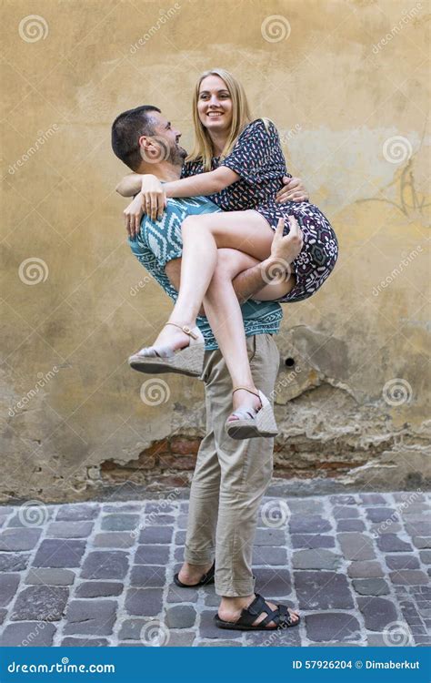 Couple In Love, Man Carrying Woman In His Arms Stock Photography ...