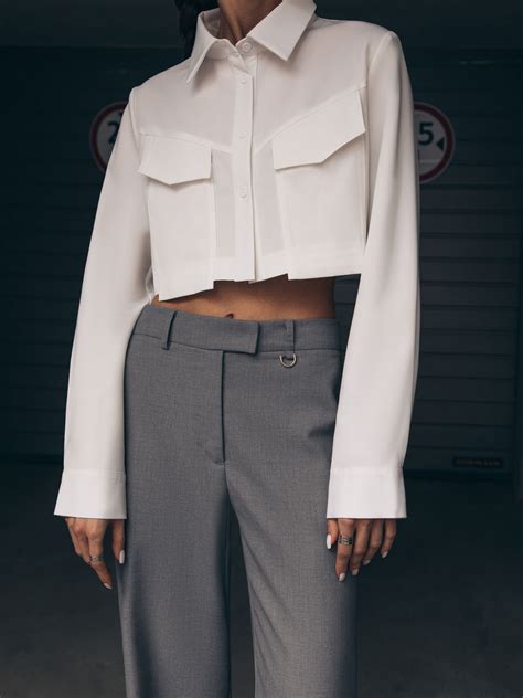 Loose cropped shirt with voluminous sleeves large chest pockets and an ...