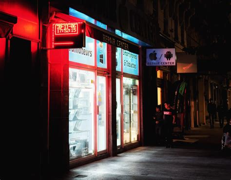 Red and White Store Front during Night Time · Free Stock Photo