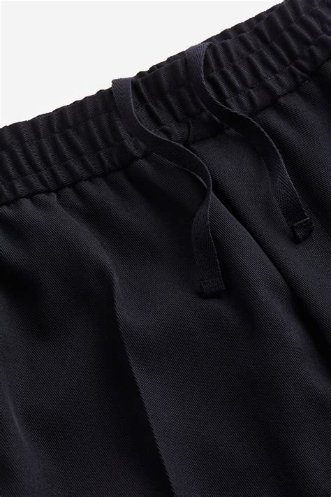 Slim Fit Dressy joggers - Navy blue - Men | H&M IN