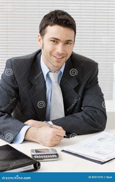 Businessman Working at Desk 的图像结果