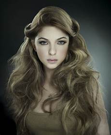 Hair And by Tousled Mass Of Hair And A Winged Fringe Hair And