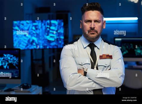 Serious mature male officer of military command center in uniform ...