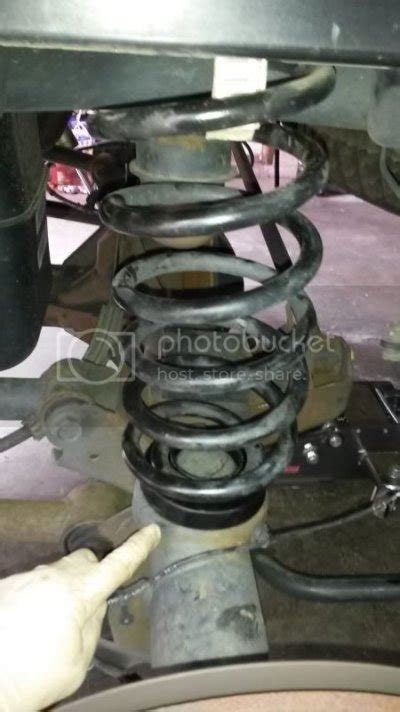 Installing Coil Spring Leveling Kit 2014 Ram 的图像结果