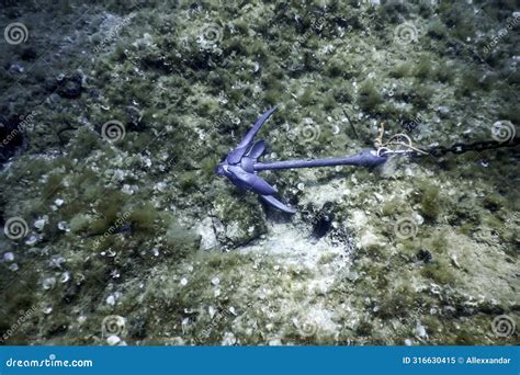 Anchor Lying On A Loch Ness Dock Stock Photography | CartoonDealer.com #54224456