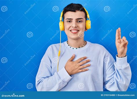 Non Binary Person Listening To Music Using Headphones Smiling Swearing ...