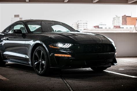 Black Mustang Car Parked on a Lot · Free Stock Photo