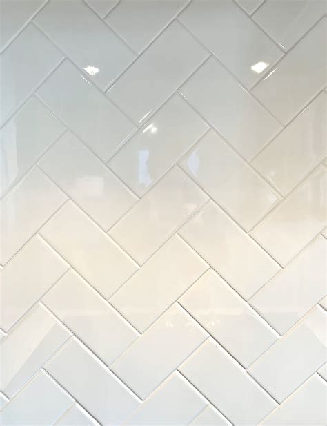 Herringbone subway tile white subway tile with light gray grout in a ...
