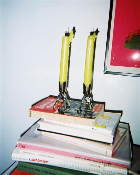 Yellow Candles on Top of Books