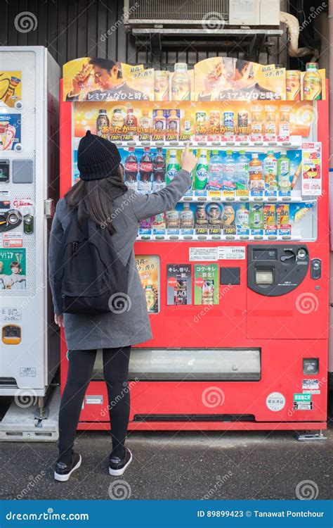 Woman Traveller Buying a Drink from Vending Machine. Editorial Stock ...