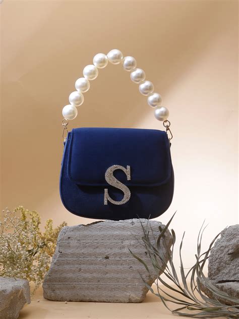 Swisni navy blue monogram clutch bag