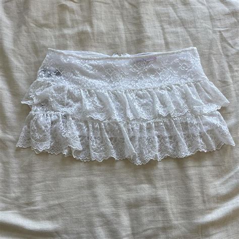 Edikted white lace mini skirt Has some black... - Depop
