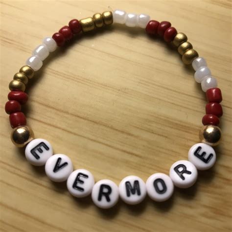 Taylor Swift’s Evermore Album themed bracelets, red,... - Depop