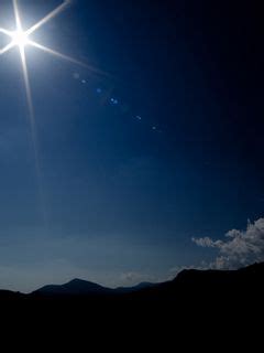 Download wallpaper 240x320 sun, light, patches of light, mountains ...