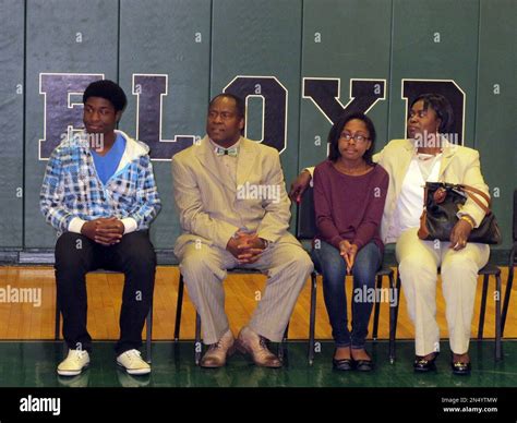 Kwasi Enin, left, prepares to speak at a press conference at William ...