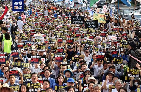 韩国民众举行大规模集会 谴责日本排放核污染水_进行_首尔_大会