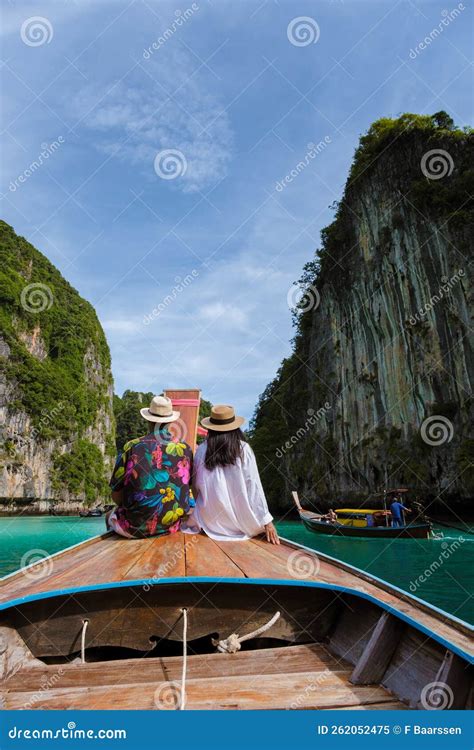 Couple in Front of Longtail Boat at the Lagoon of Koh Phi Phi Thailand ...
